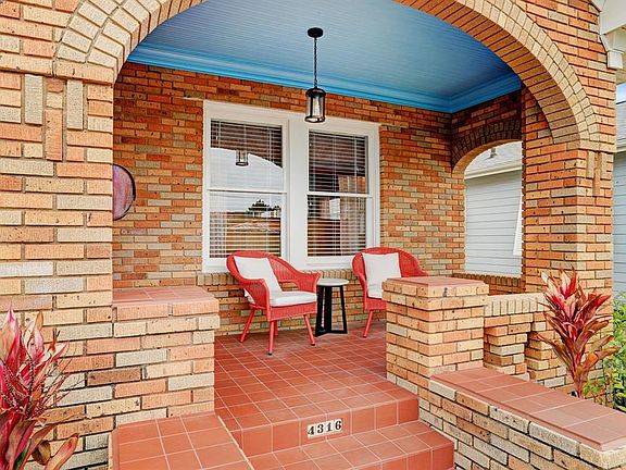 Covered front porch is large enough for furniture. House faces the Gulf of Mexico, a 2 1/2 block walk.
