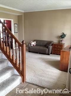 Living Room
						:
						Opens up to the right of the entry.