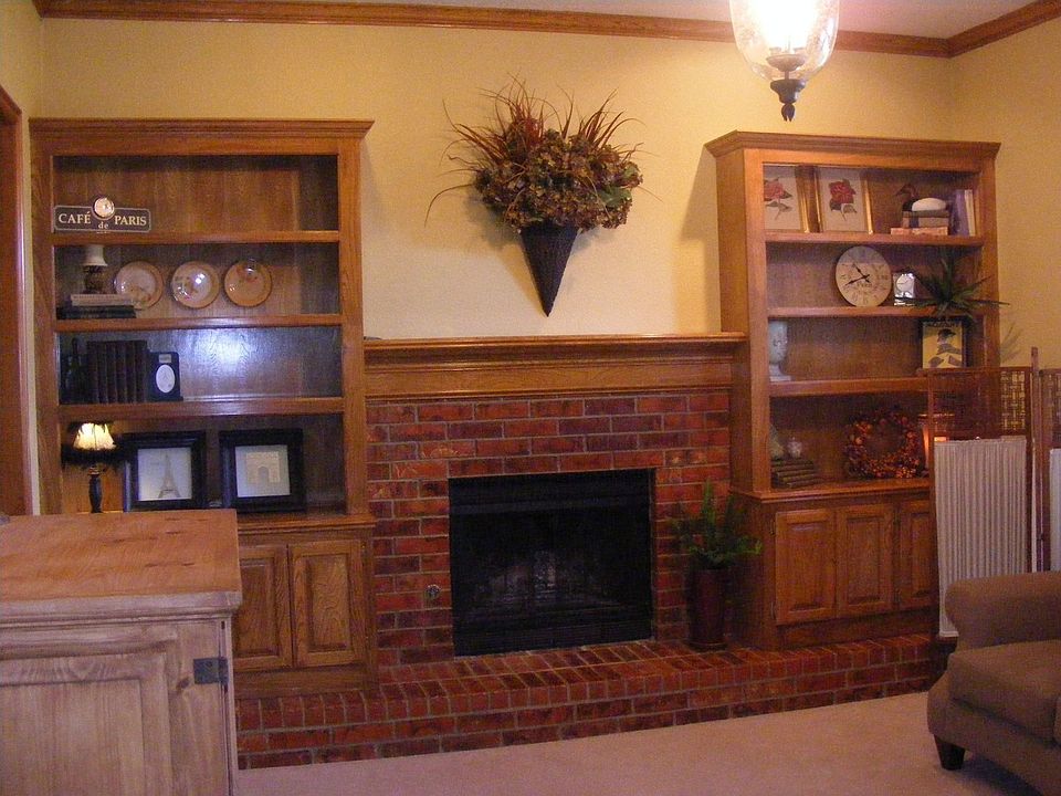 Fireplace & built in bookshelves in living room