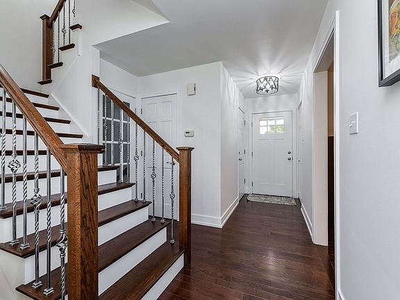 Walk-through the front door to new, beautiful solid hardwood floors, totally redone staircase, updat