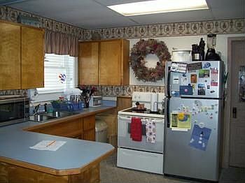 Kitchen with appliance and a large countertop.
