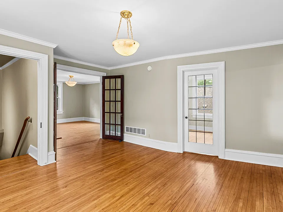 Versatile living space with hardwood floors and beautiful French doors.