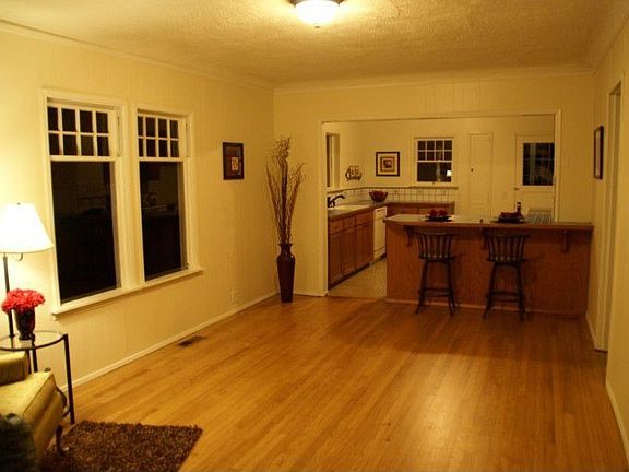 Large living room with nicely finished solid oak floors.