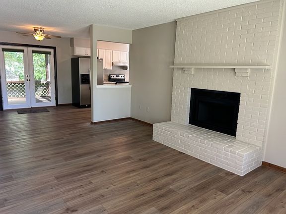 As you walk in the front door you're greeted by the fireplace and how light and bright the whole home feels...