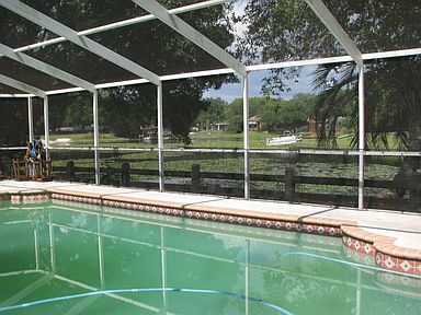 Caged Pool Overlooking Lake Magdalene