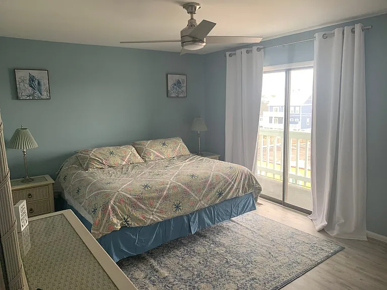 King size master bedroom with balcony and harbor view