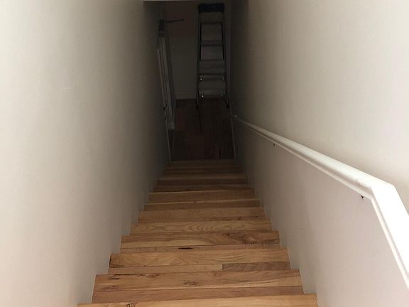 Stairs going to attached garage