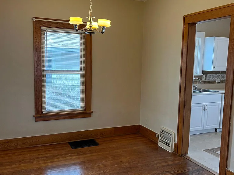 Great size dining room with refinished floors and fresh paint.