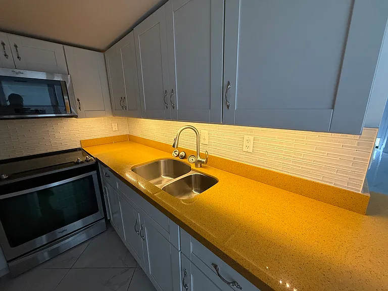 Under-cabinet soft, dimmable LED lighting for late-night trips to the KITCHEN