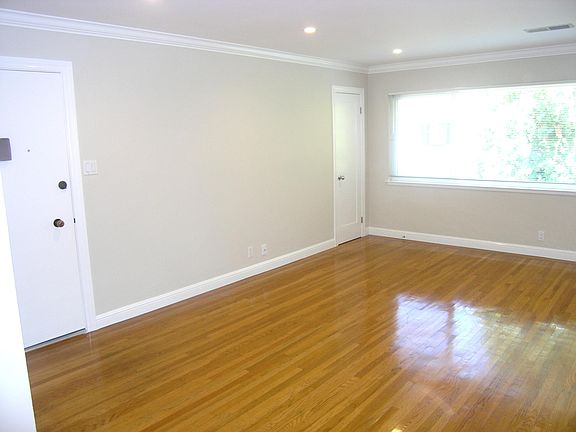 Living room, with closet in the corner by the window