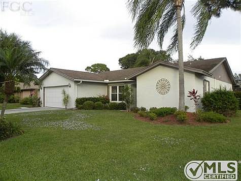 Front of 5721 Stonehaven Dr N Ft Myers FL on oversized quarter acre lot.