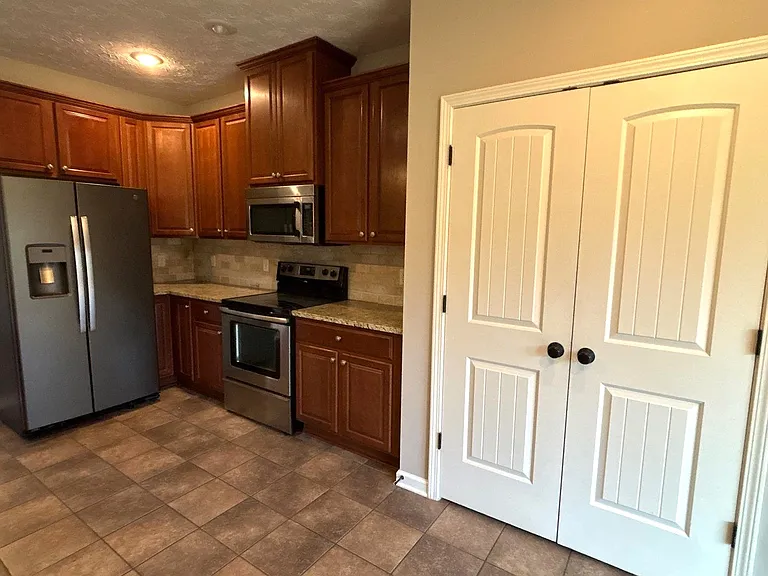 Kitchen with large pantry closet