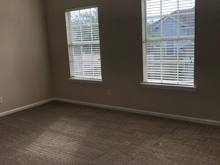 spacious master bedroom with lots of light