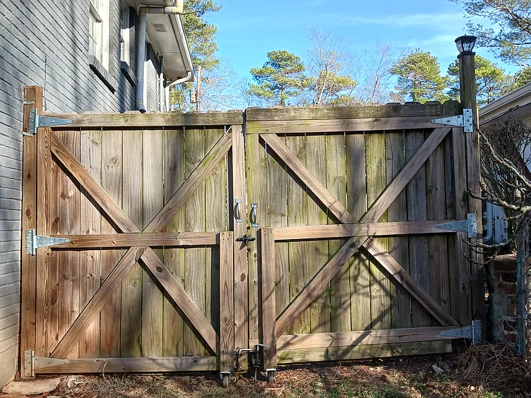 Backyard is enclosed by gates