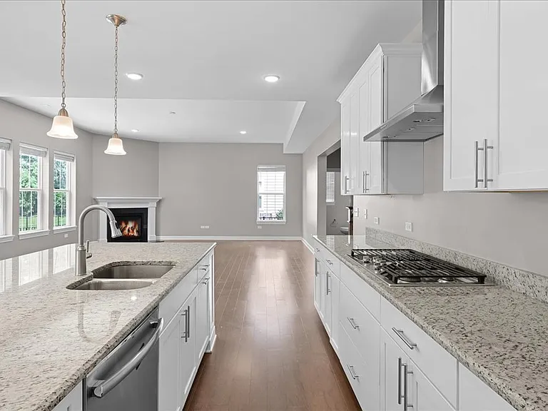 Stunning kitchen with stainless steel appliances, granite counters, and open concept
