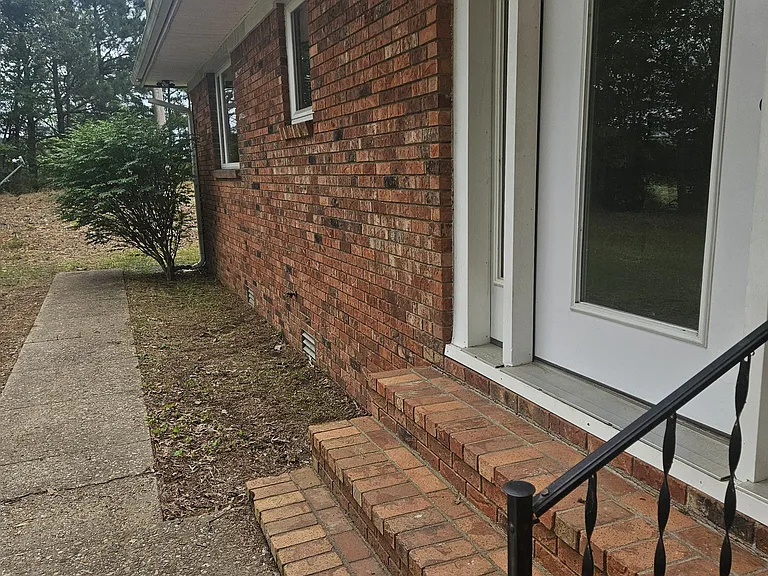 Front entrance. I will pay for landscaping materials and plants if someone wants to dress up these planters with gardenia bushes, flower or make a herb garden!!