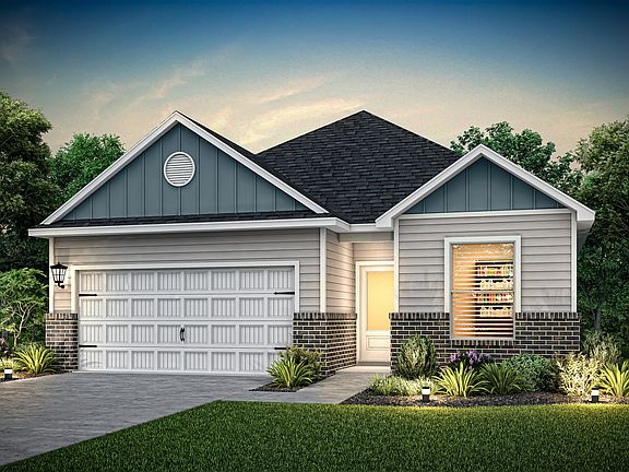 This single story home has siding and brick