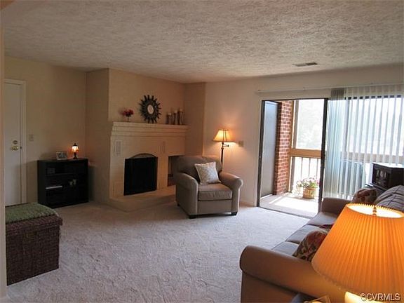 Spacious living room flows out to screened balcony
