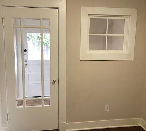 dining room looking through laundry to back door