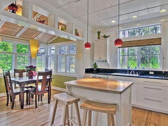 The open floor plan on the main level with exquisite millwork detail throughout. The dining room and
