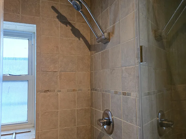 First floor full bath walk in shower with multi function massage fixture, unique and fun