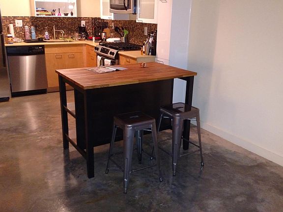 Includes kitchen island with two stools.