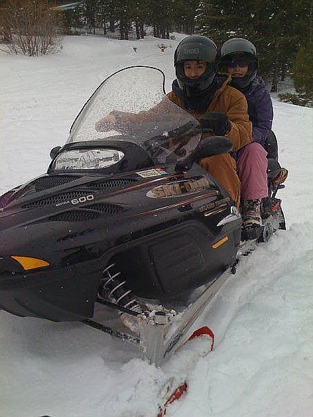 Snowmobiling on a nearby trail