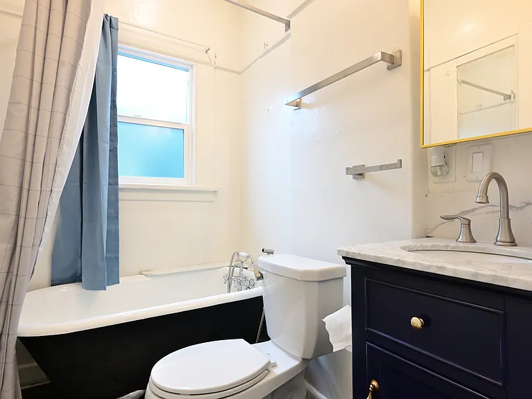 upgraded bathroom with tiled floor, repainted claw foot tub