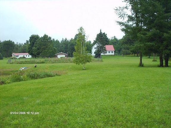 View of homestead from pond edge