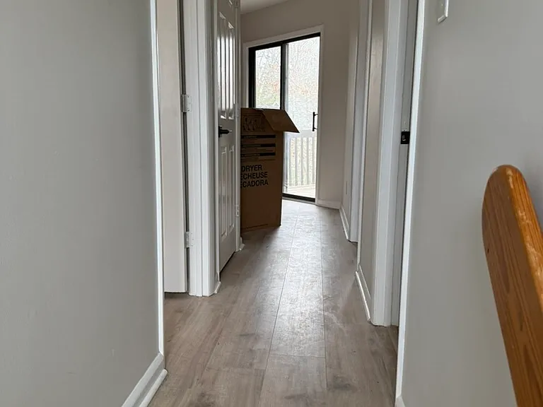 Upstairs. 
Bedroom 1 to the left. 
Full bath with washer and dryer to the right.
Next door to the right Bedroom 1. 
Next door to the left large storage closet.