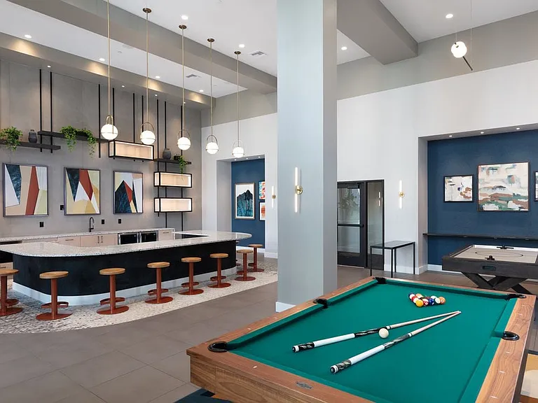 Clubroom with game area and entertaining kitchen