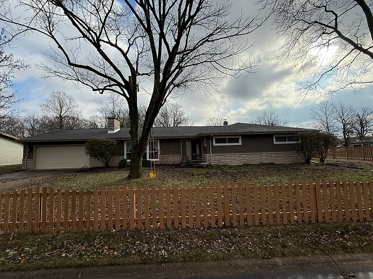Two car garage, fenced in yard and bus stop right around the corner