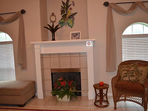 Wonderful lighting in the living area with a cozy fireplace.