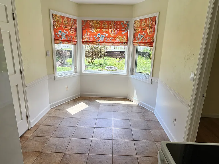 Breakfast nook overlooking fenced-in garden