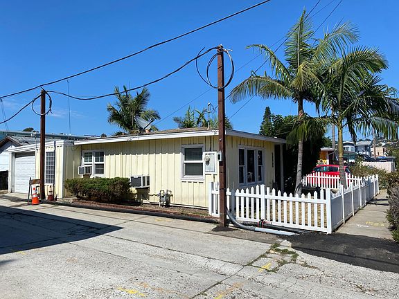 Side shot of home showing attached garage.