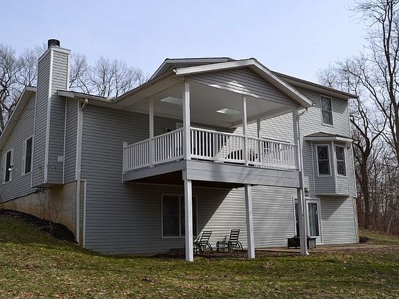 House sits on 1.3 acre lot overlooking woods and a pond.
