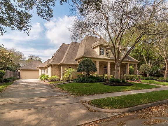 Wooded corner location. Manicured landscaping.