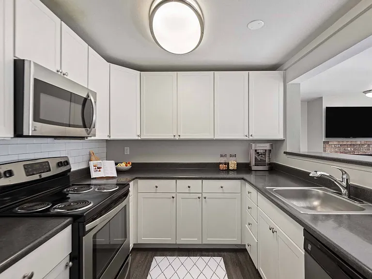 Cook, prep, and entertain with ease in this spacious kitchen, featuring plenty of counter space for every culinary creation