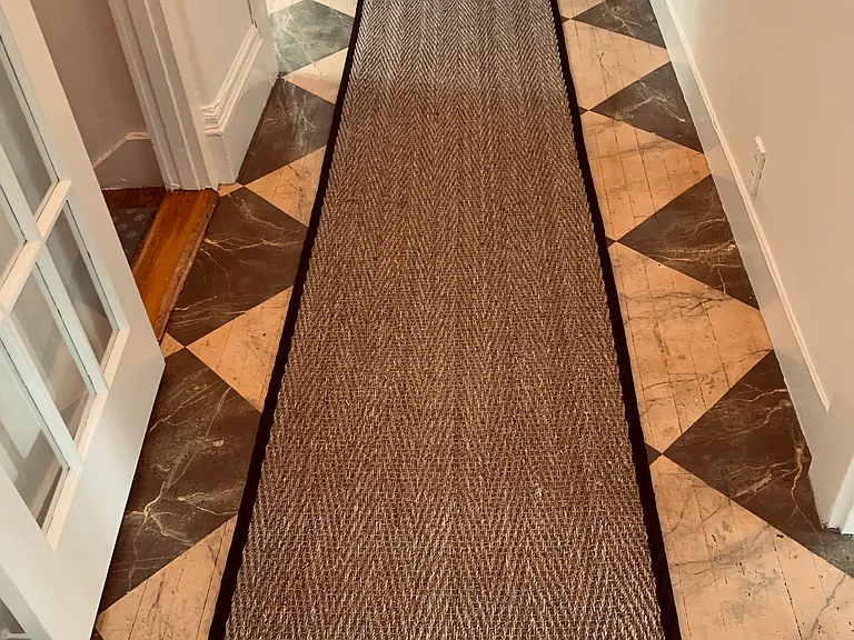 painted floor with runner in hallway