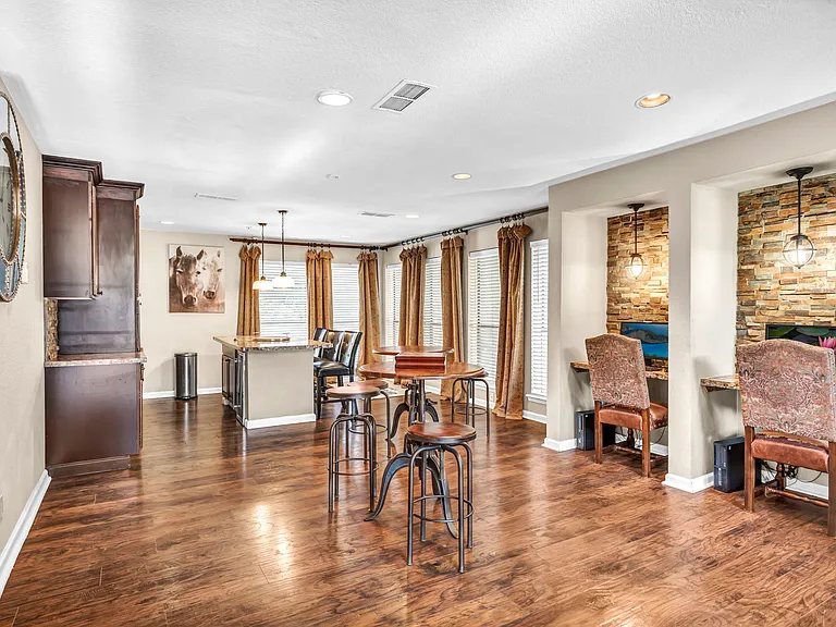 Resident clubhouse featuring comfortable lounge seating and dining space for gatherings.