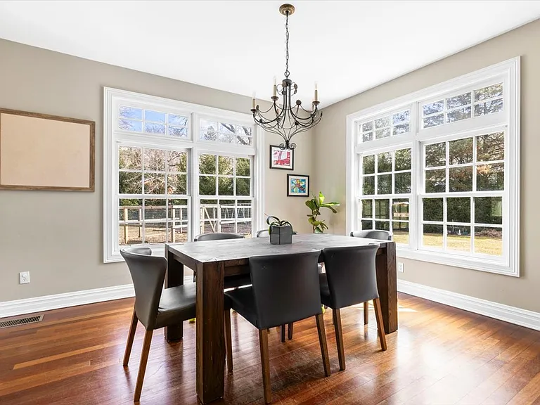 Informal Dinins area adjacent to kitchen with door to covered stone patio