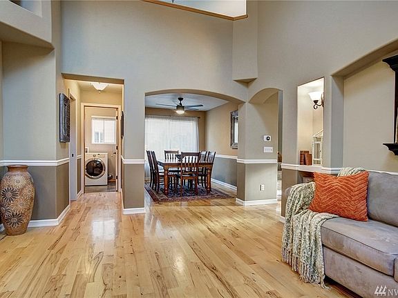 Here you can see the glamorous two-tone paint and one of the two built-in shelves with sconces on either side of the formal living room's arched alcove.  