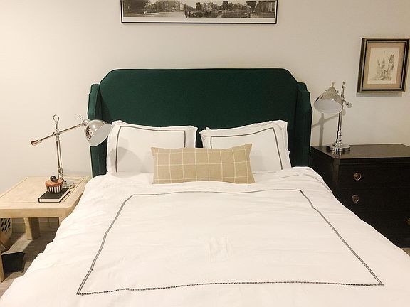 First floor bedroom is spacious and has two closets for ample storage.