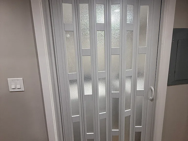 Laundry closet doorway in hallway