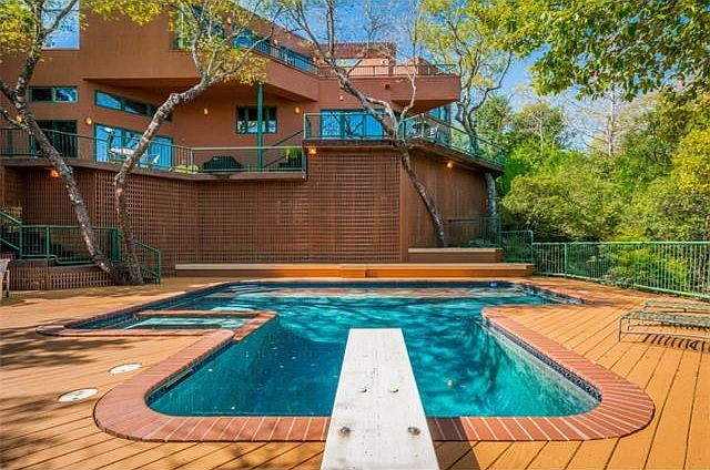 STUNNING contemporary home in the heart of Lakeway! Your own private estate on 1.5 acres.