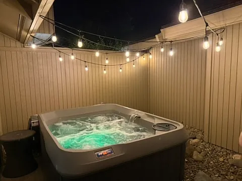 Hot tub in private atrium off primary bedroom