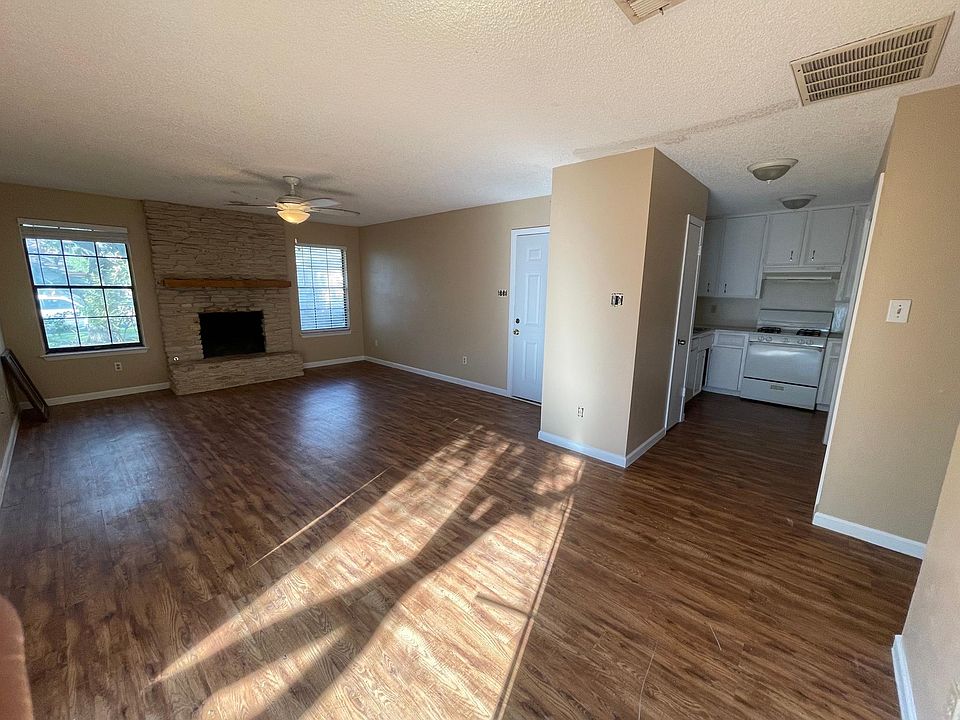 brand new wood flooring, new paint on the wall