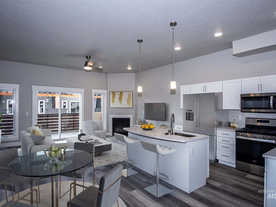 Open great room and kitchen. Fireplace and large balcony. Ceiling fan