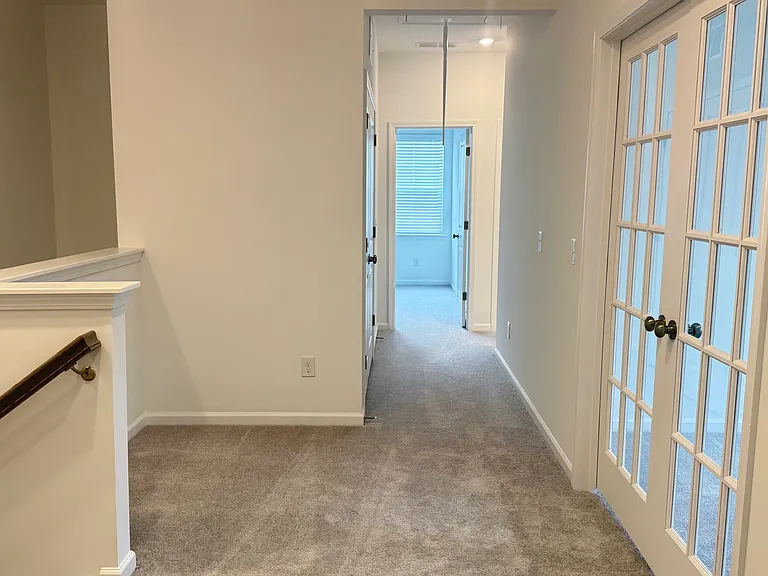 Spacious Upstairs Hallway with Easy Access to All Bedrooms _