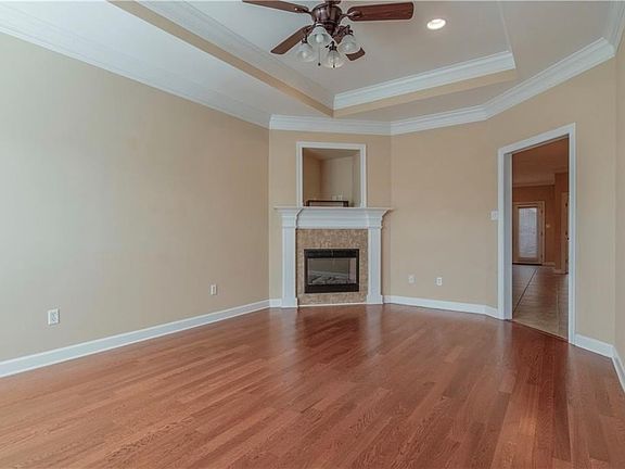 The first level includes the living room, large kitchen, master suite, additional half bath and access to the attached garage.